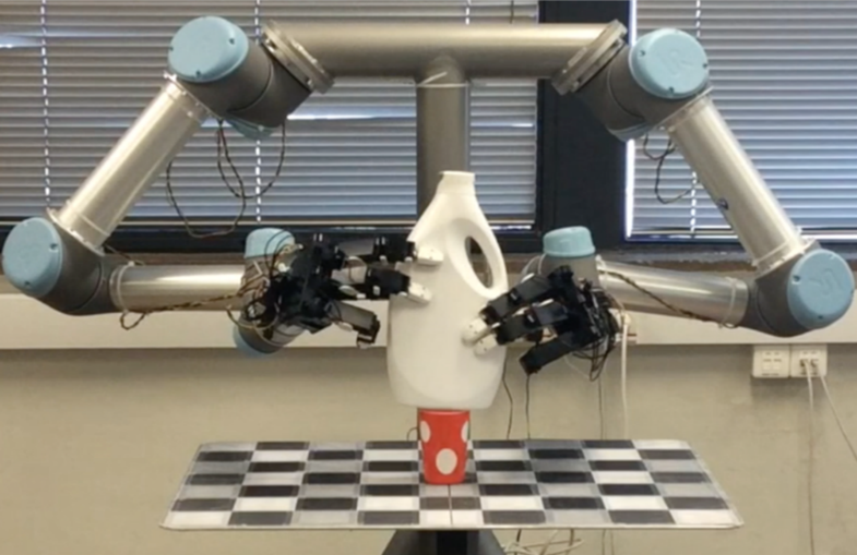 robotic arms handling a bottle